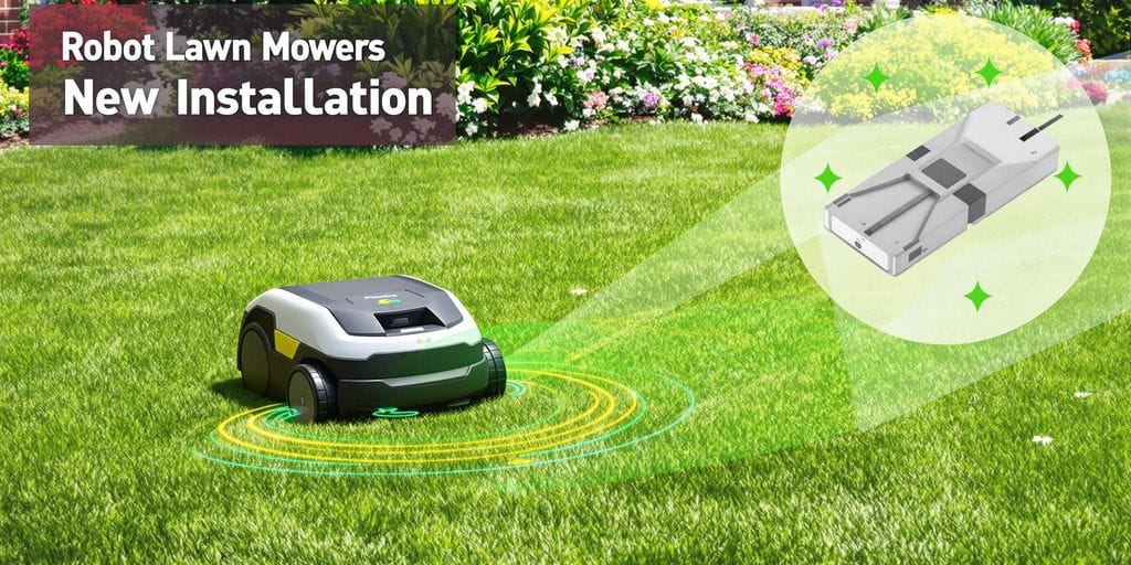 Robotgräsklippare med kabel i grön trädgårdsmiljö.